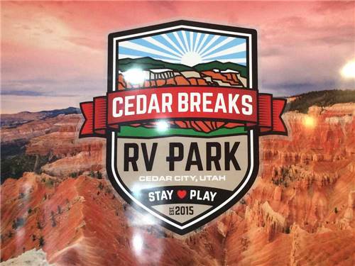 The logo with mountains at CEDAR BREAKS RV PARK