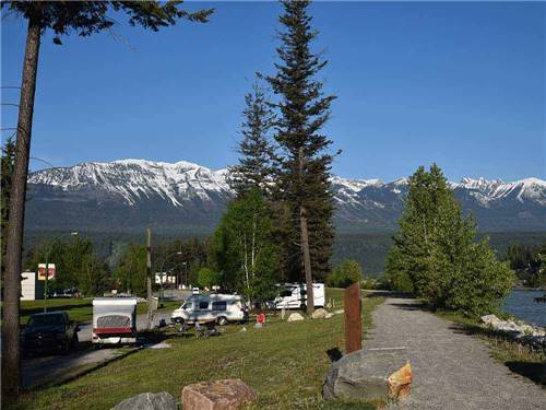 RV sites with snowcapped mountains in the background at GOLDEN MUNICIPAL CAMPGROUND