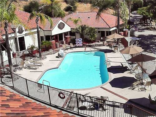 Aerial view of swimming pool and outdoor seating at RANCHO LOS COCHES RV PARK