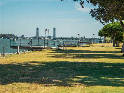 A view of the docks and grassy area at DUCK ISLAND RV PARK & FISHING RESORT
