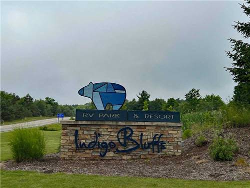 Welcome sign outside property at INDIGO BLUFFS RV PARK AND RESORT