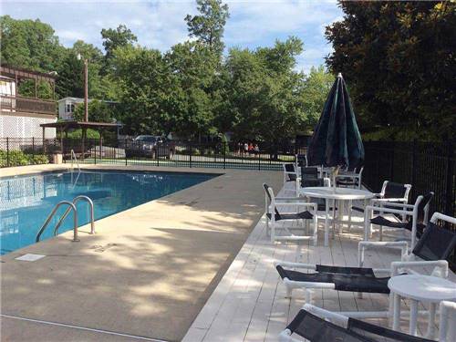 Swimming pool with outdoor seating at LAKEWOOD RV RESORT