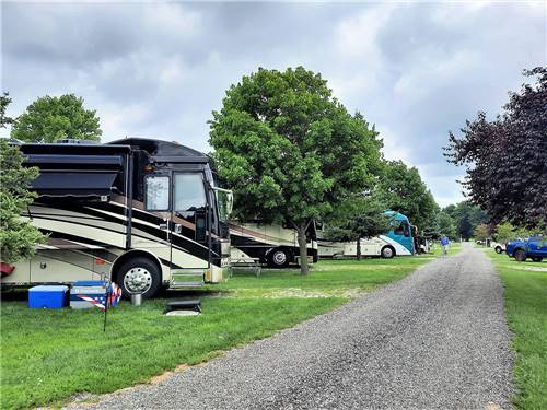 The gravel road next to the parked RVs at SHIPSHEWANA CAMPGROUND SOUTH PARK
