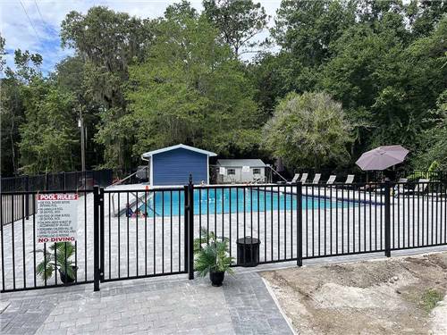The fenced in swimming pool at HIGH SPRINGS RV RESORT & CAMPGROUND