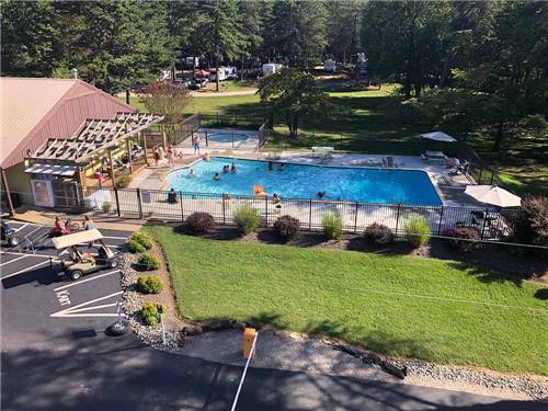 An aerial view of the pool and rec hall at COZY ACRES CAMPGROUND/RV PARK