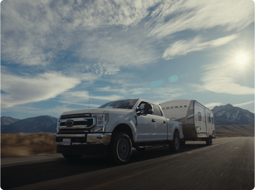 Truck towing a motorhome on the open road