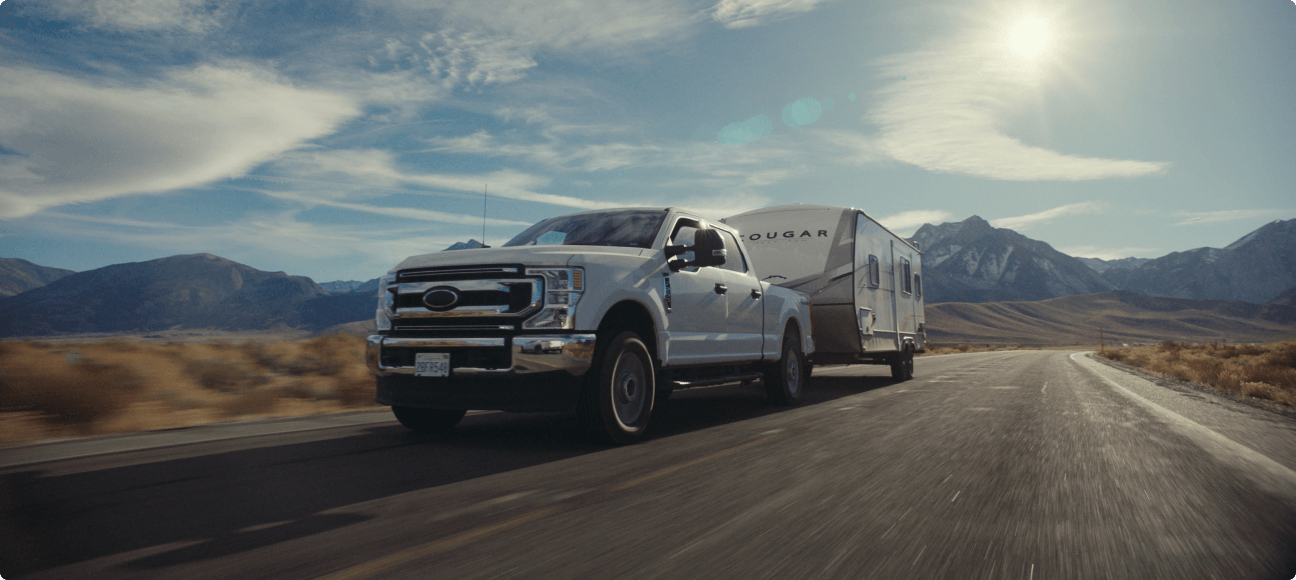 Truck towing a motorhome on the open road