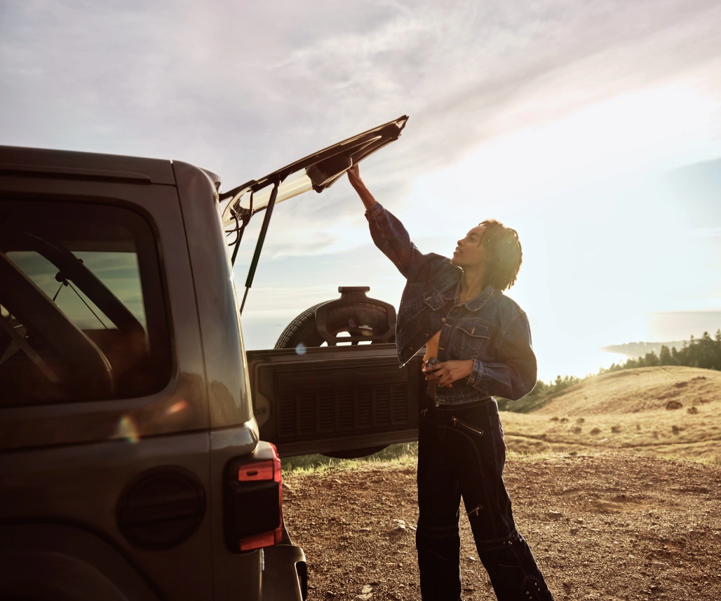 Woman opening the back of her car