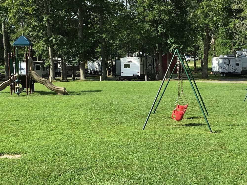 A swing set and children's playground at SOUTH FORTY RV CAMPGROUND