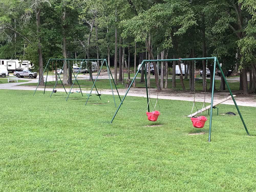 Two swing sets and teeter totter at SOUTH FORTY RV CAMPGROUND