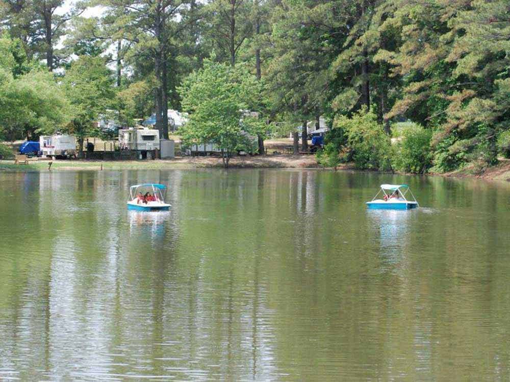People in paddleboats at GREEN ACRES FAMILY CAMPGROUND