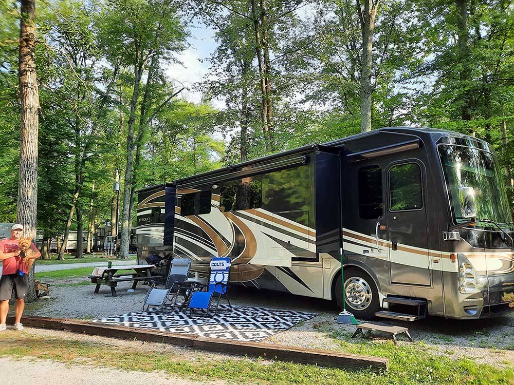 Class A Motorhome at campsite at COLUMBUS WOODS-N-WATERS KAMPGROUND