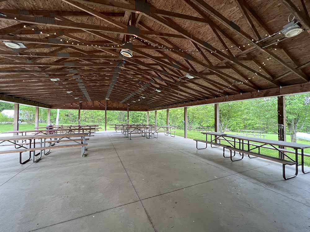 A large pavilion with picnic tables at MAPLE LAKES RECREATIONAL PARK