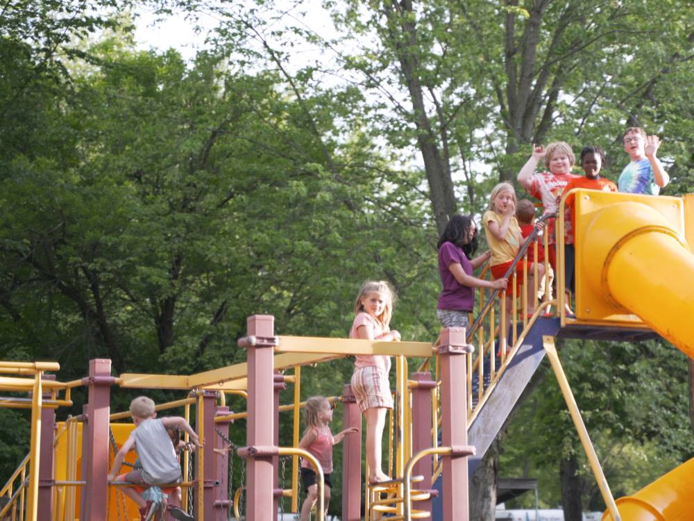 Kids in line to use the slide at the playground at Indiana Beach Campground