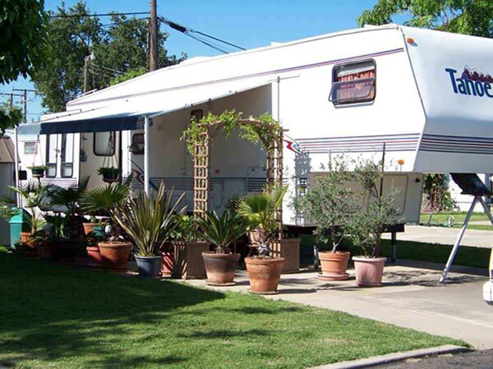 A Tahoe fifth wheel trailer in a site at COUNTRY MANOR RV & MH COMMUNITY