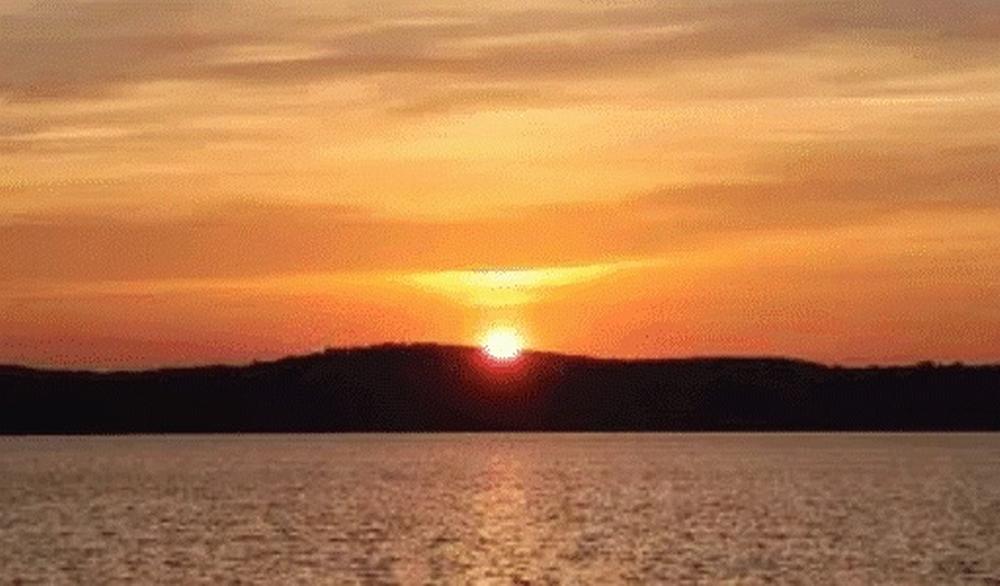 Sunset by the water