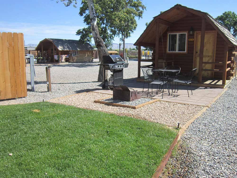 Lodging with outdoor seating and grill at GRAND JUNCTION KOA