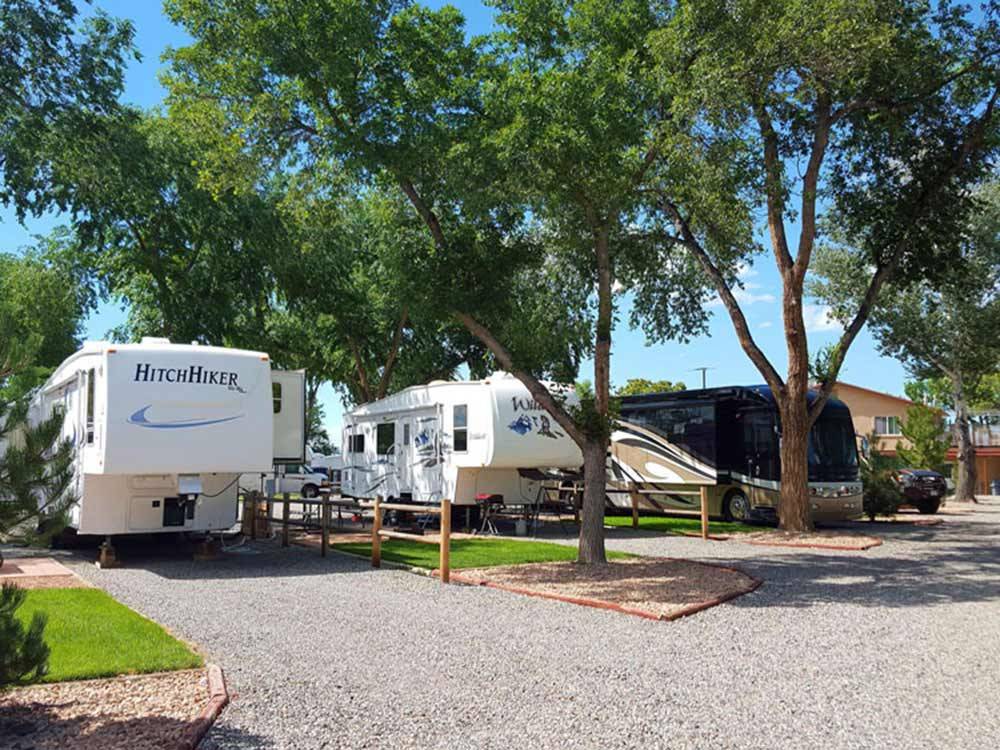 Two white trailers and one large motorhome at GRAND JUNCTION KOA
