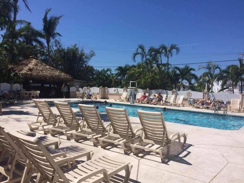 Swimming pool with outdoor seating at BOYD'S KEY WEST CAMPGROUND