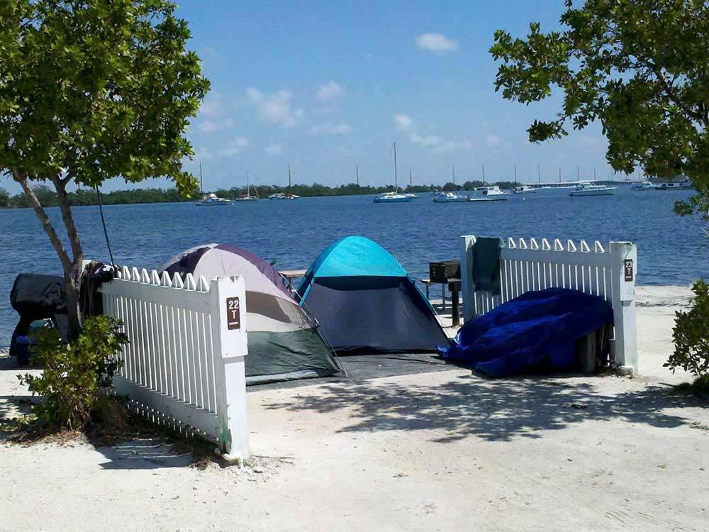 Tents at campsites on the lake at BOYD'S KEY WEST CAMPGROUND
