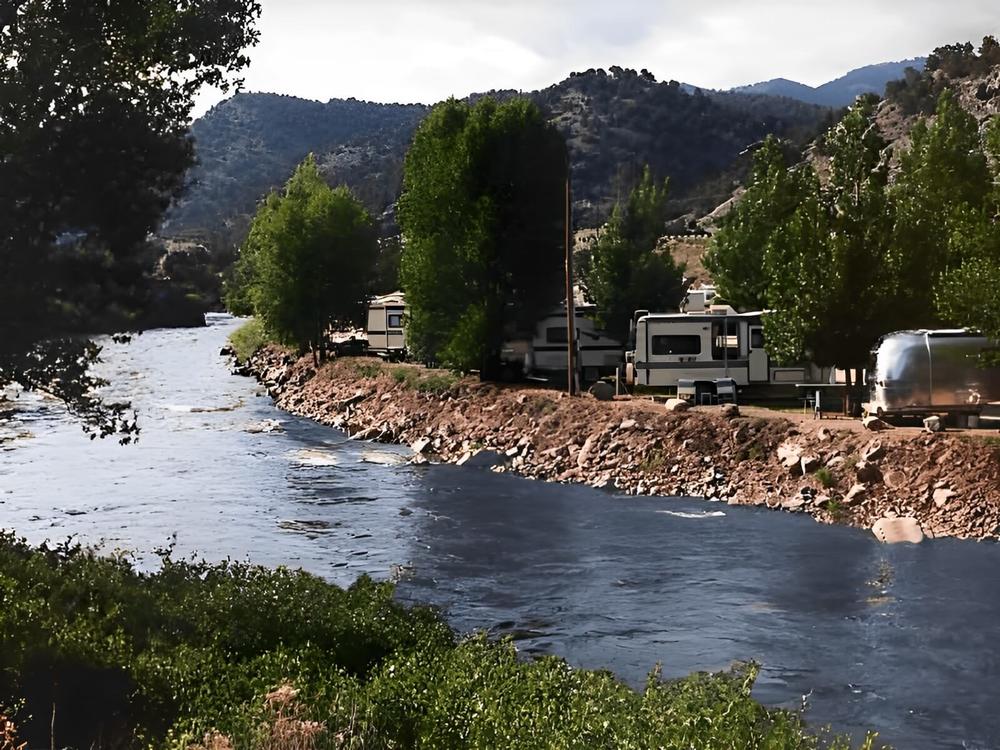 RV sites on the river at Four Seasons RV Resort