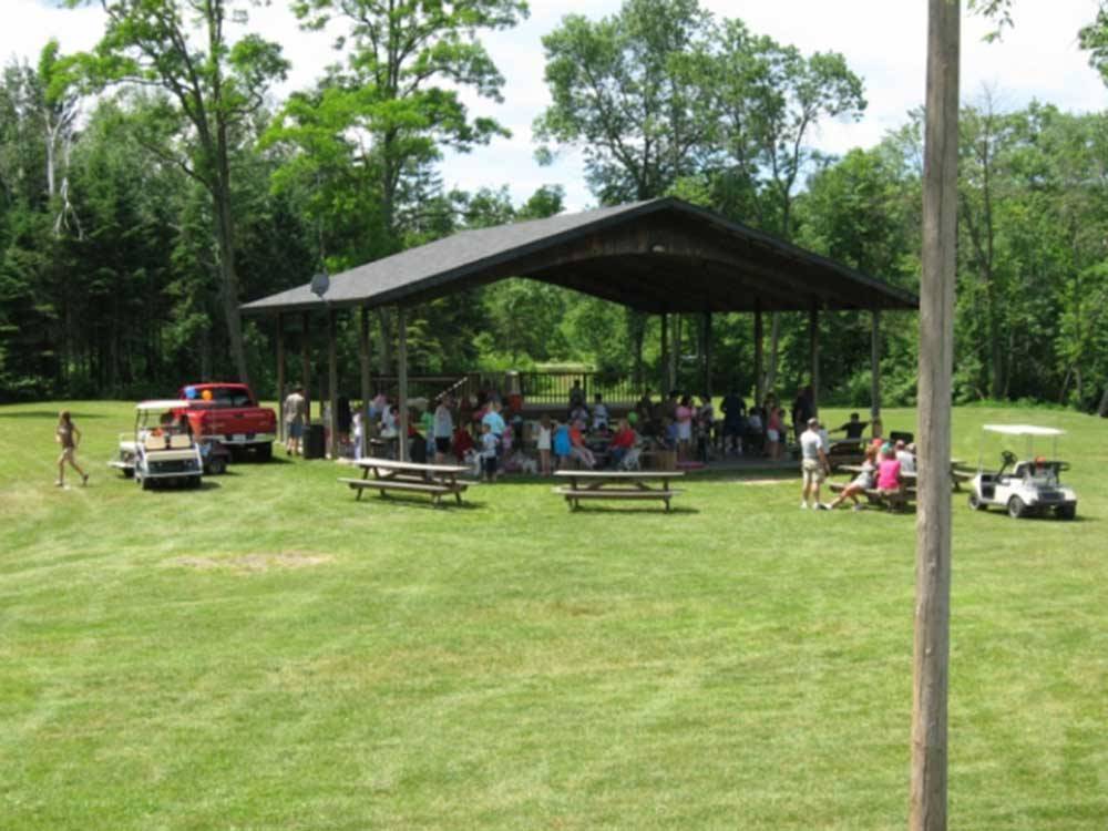 People gathering in the pavilion at LAKE OF THE WOODS CAMPGROUND