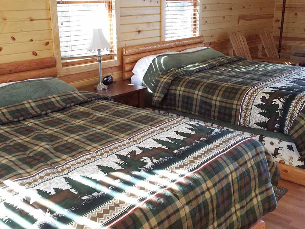 The beds in the rental cabins at LAKE DUBAY SHORES CAMPGROUND
