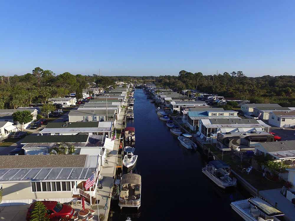 Aerial view of mobile home park along water ways at UPRIVER RV RESORT