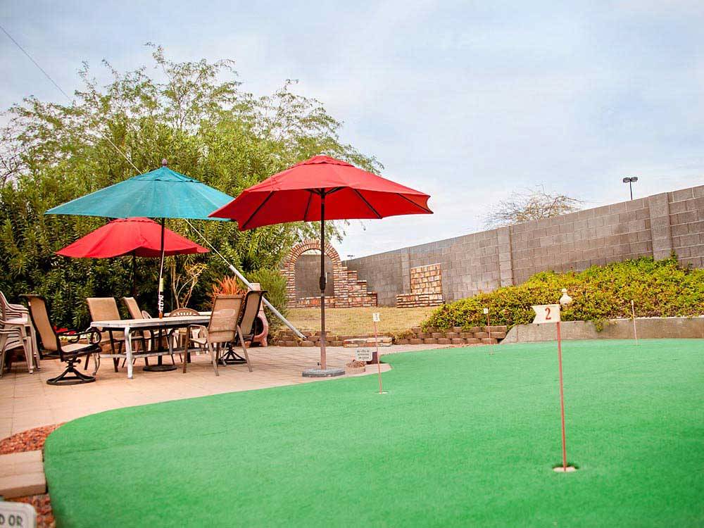 Putting green with outdoor seating at ENCORE SUNI SANDS
