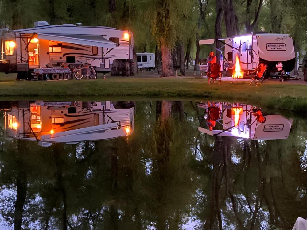 RVs reflecting off the water at night