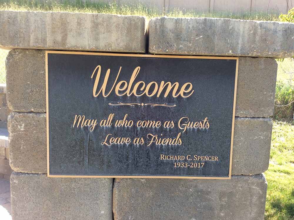 The black and gold welcome plaque  at CENTURY RV PARK & CAMPGROUND