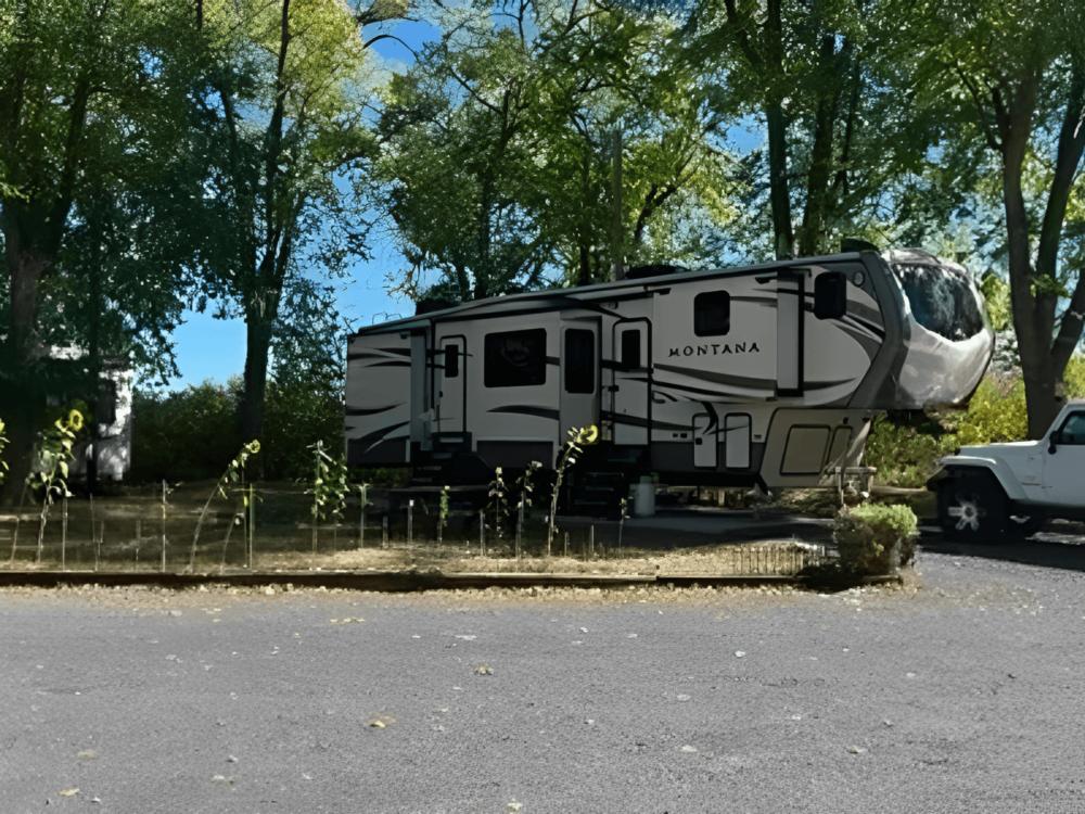 RV parked at site Burns RV Park