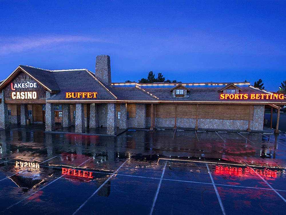 The front of the casino at night at LAKESIDE CASINO & RV PARK