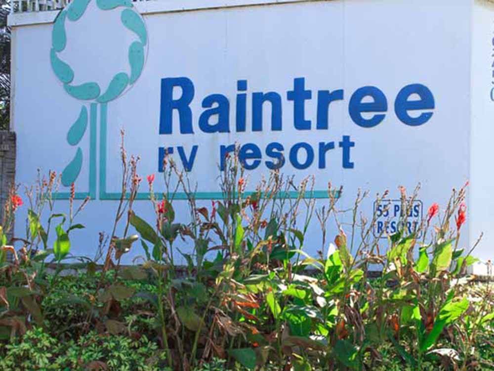 The front entrance sign at RAINTREE RV RESORT