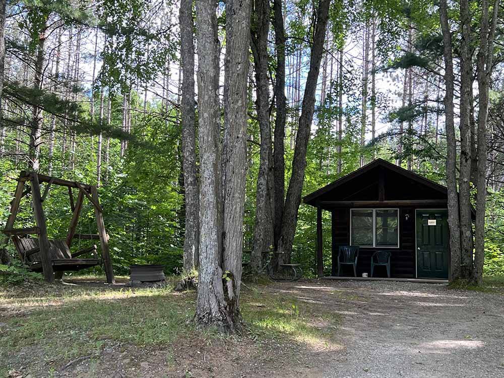 One of the rustic rental cabins at KALKASKA RV PARK & CAMPGROUND