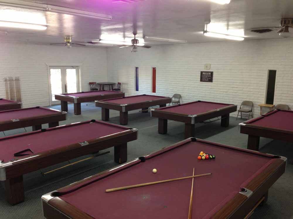 A group of red pool tables at DESERT SHADOWS RV RESORT