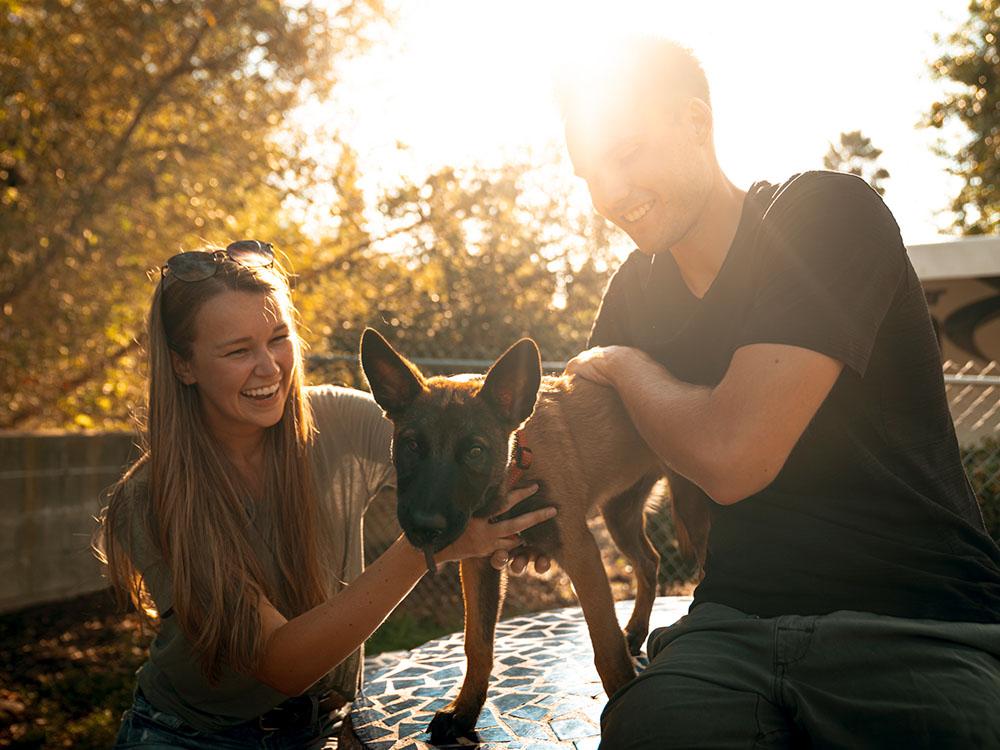 A couple with their dog at SAN DIEGO RV RESORT