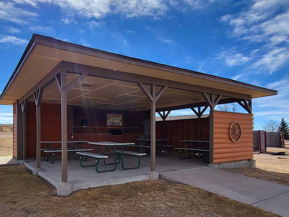 The pavilion with picnic benches at CHEYENNE RV RESORT BY RJOURNEY
