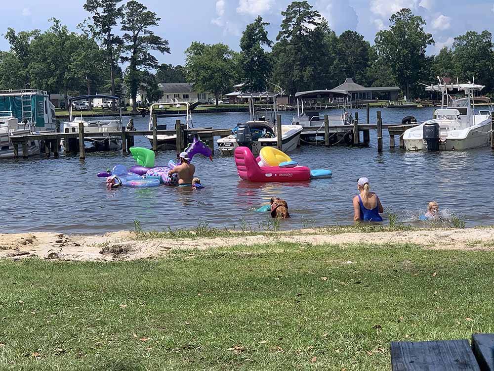 People playing in the water at TAW CAW CAMPGROUND & MARINA