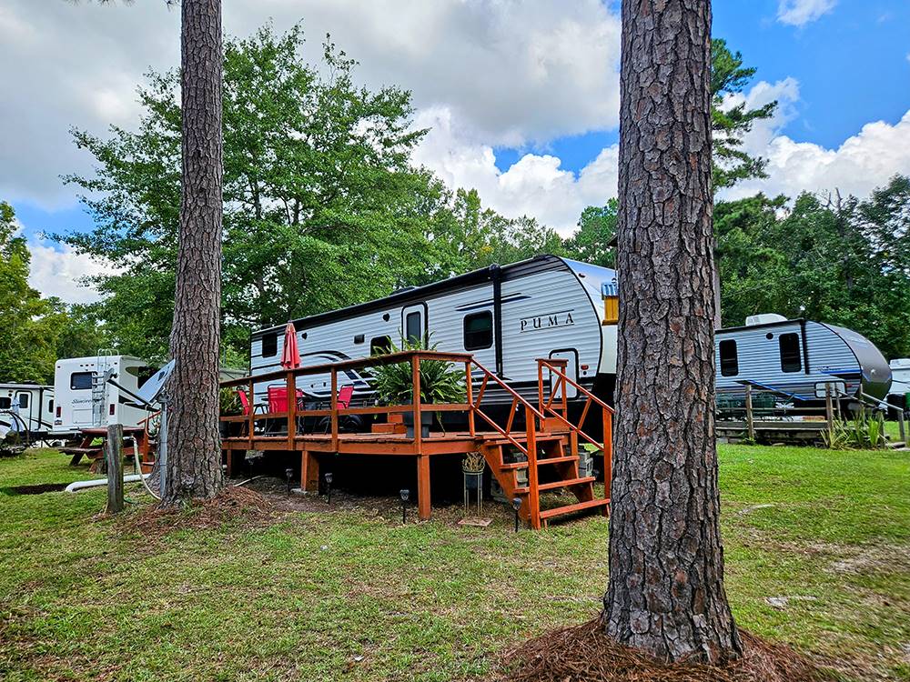 Travel trailer parked at a site at Taw Caw Campground & Marina