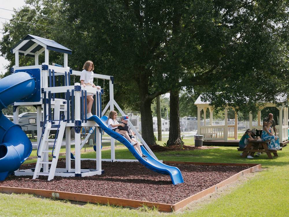 Children on the slide at the playground at Bayberry RV Park