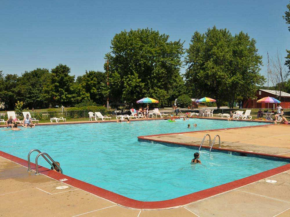 Swimming pool with outdoor seating at THOUSAND TRAILS GETTYSBURG FARM
