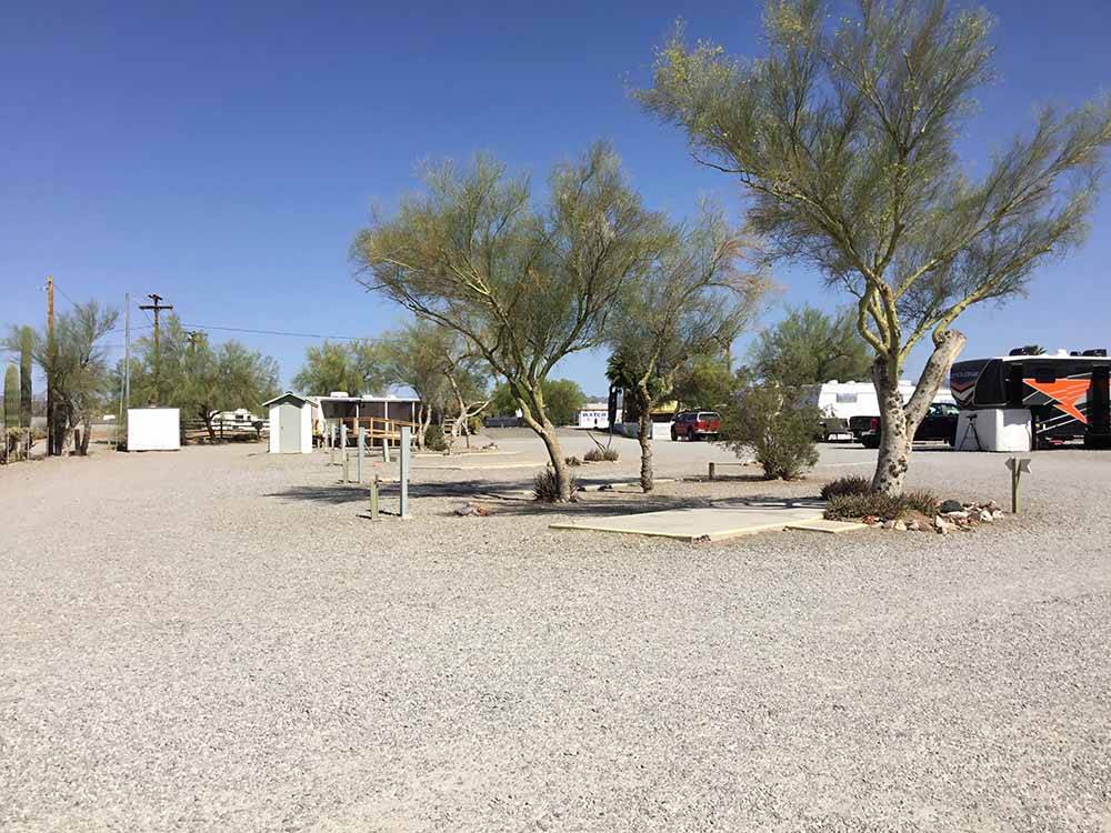 A group of gravel RV sites at THE SCENIC ROAD RV PARK