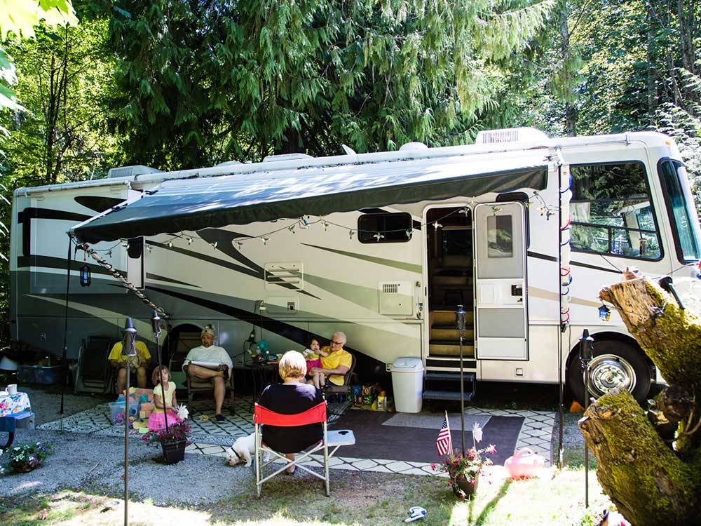 Folks camping with RV at TALL CHIEF CAMPGROUND