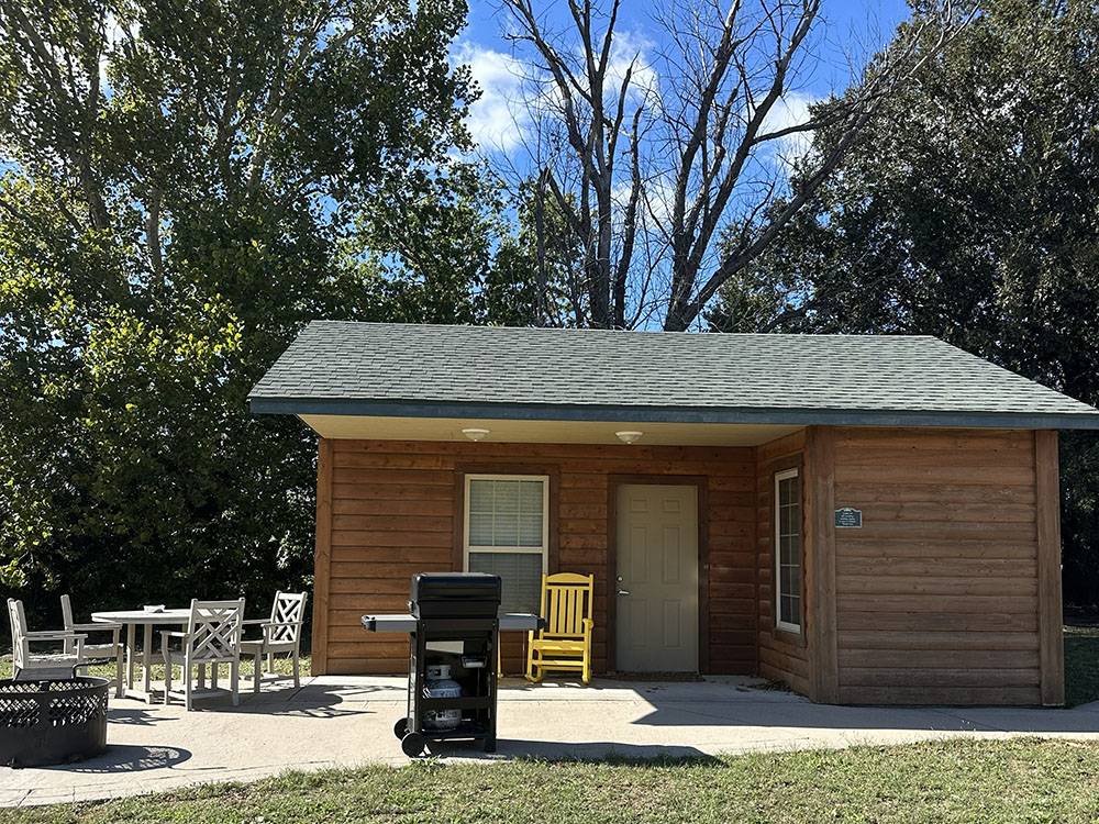 A patio with a bbq outside a rental
