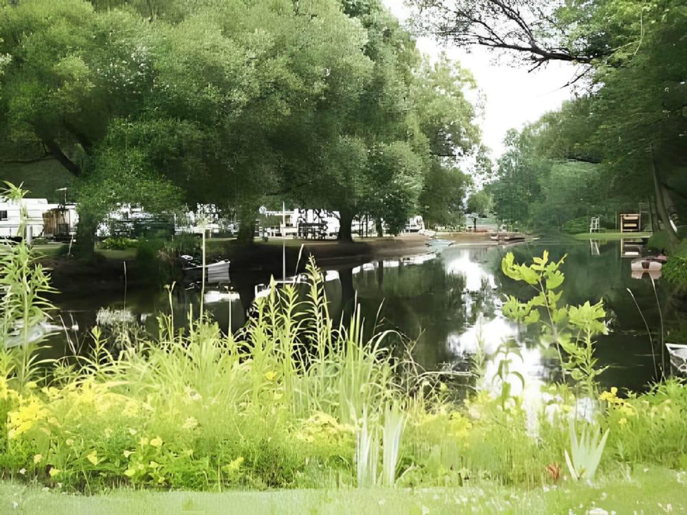 Pond surrounded by campsites