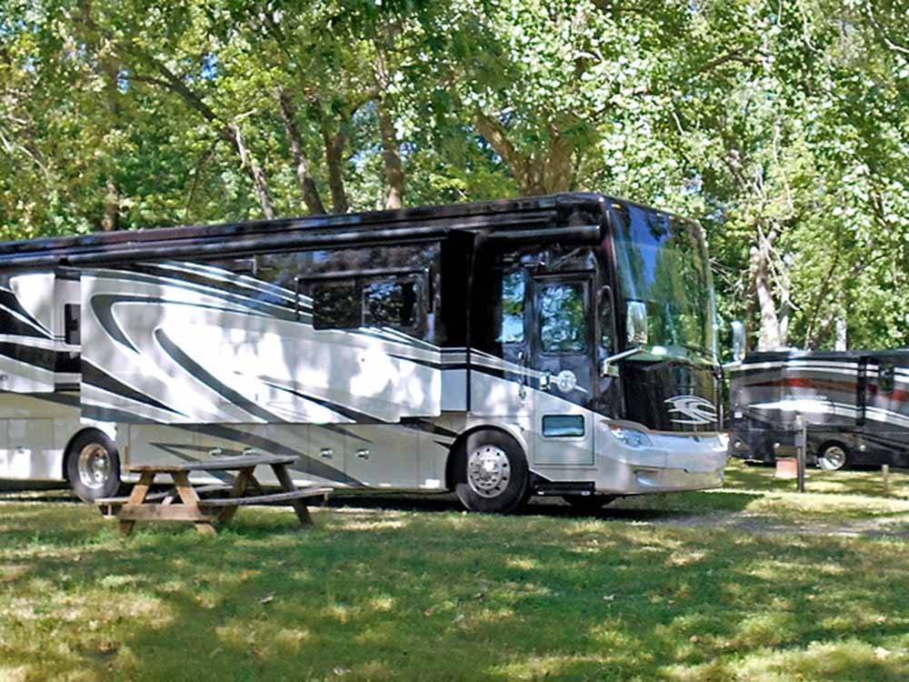 A class A motorhome in a RV site at MILLPOINT RV PARK