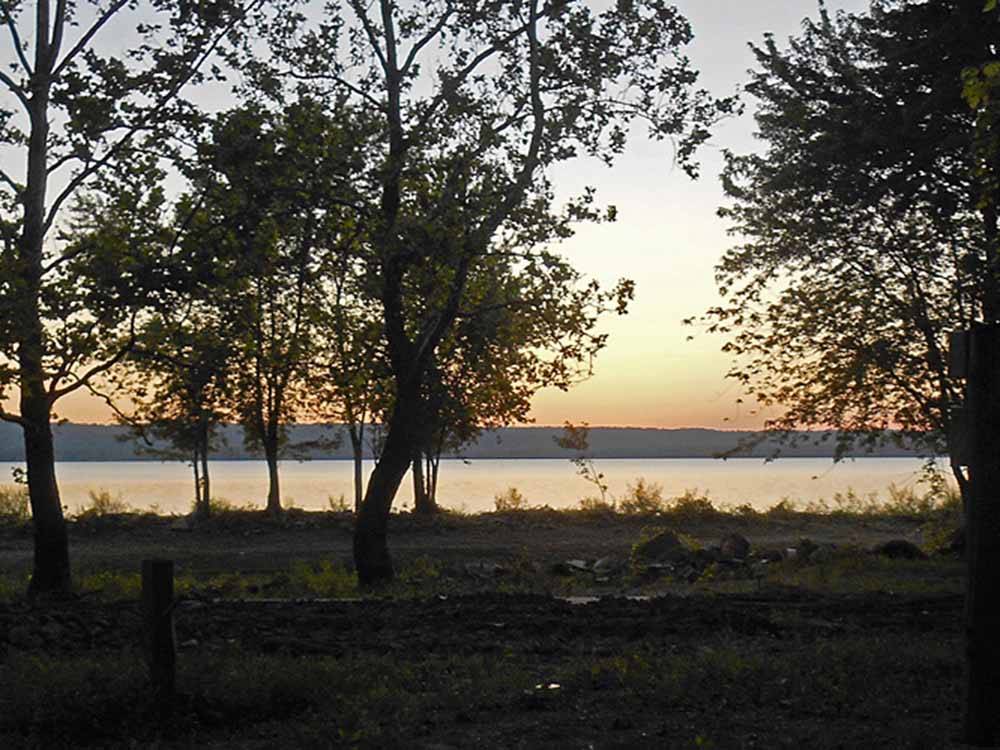 The water and trees at dusk at MILLPOINT RV PARK