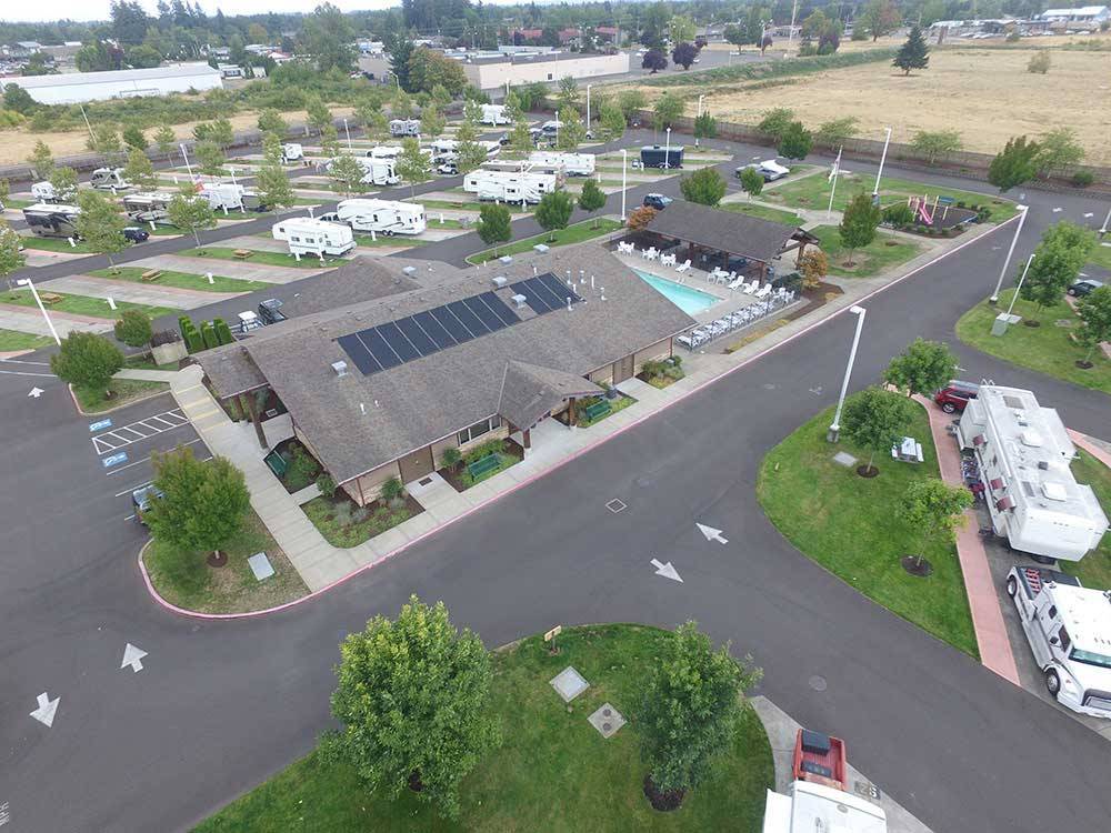 Aerial view over campground, lodge, swimming pool at HEE HEE ILLAHEE RV RESORT
