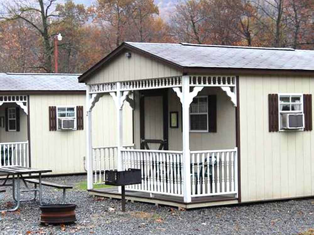 A row of rental cabins at WATERSIDE CAMPGROUND & RV PARK